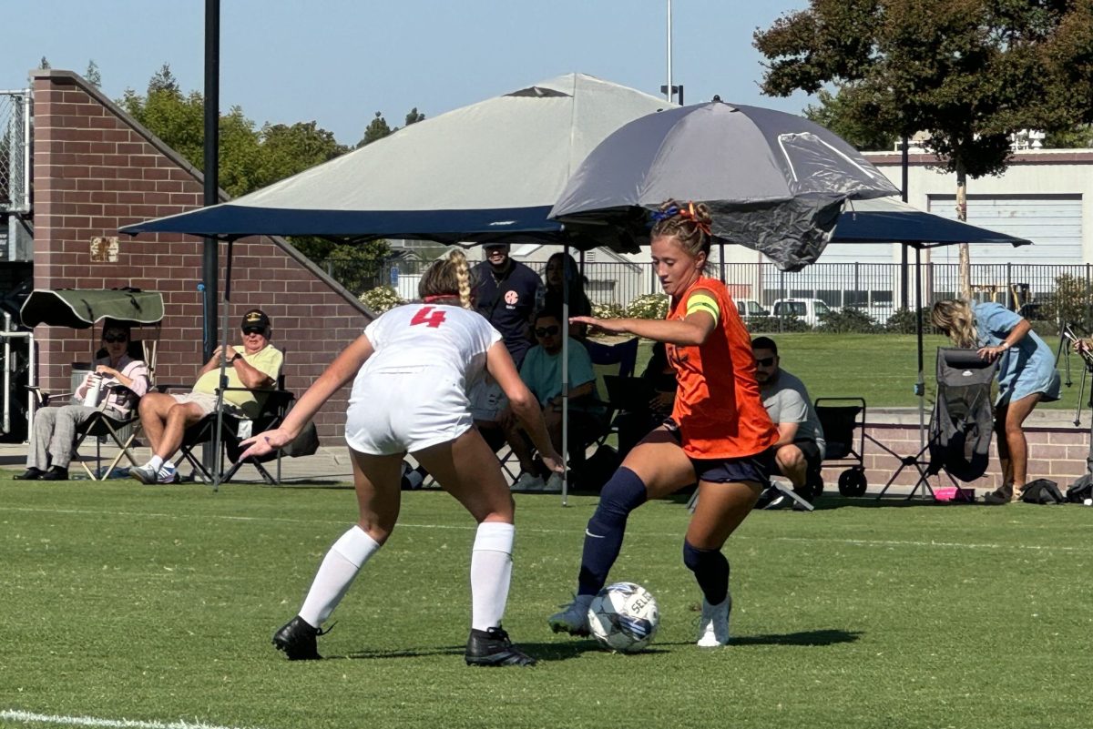 Freshman forward Sadie Stoll, right, goes head-to-head against freshman Las Positas defender Kylie Hahlbeck on Aug. 27. Stoll scores her first goal as a CRC Hawk.