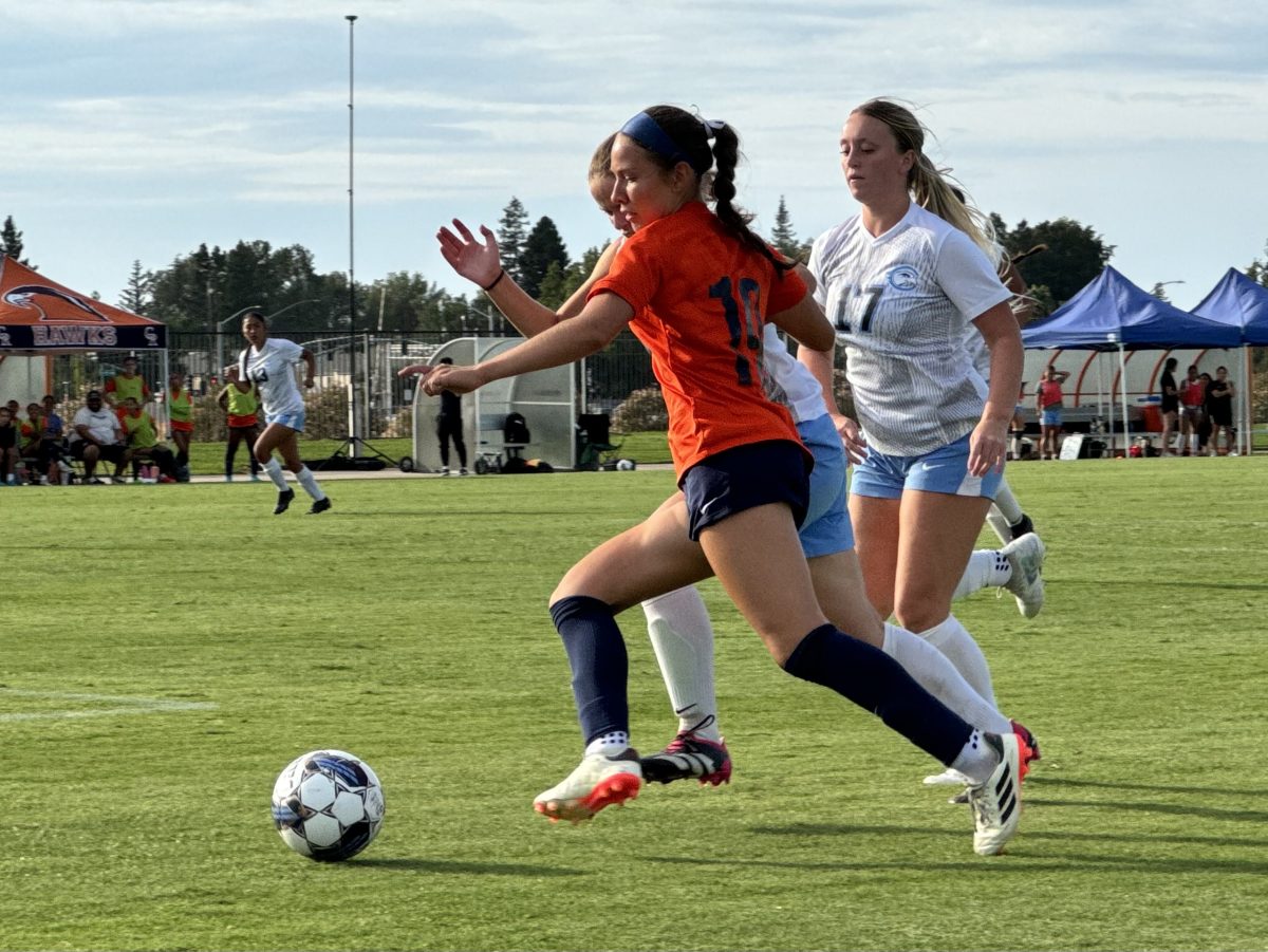 Freshman forward Mia Perz (center) kicks in a goal against the Cabrillo Community College Seahawks at home on Tuesday. The Hawks go on to dominate Cabrillo 6-0 and will face the Cañada Community College Colts in Redwood City on Friday.