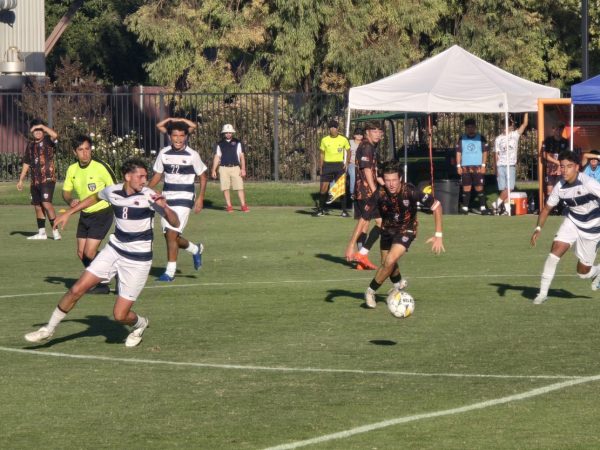 Hawks sophomore midfielder Mason Harder makes a play on the ball at the end of the first half in their match against the Santa Rosa Bear Cubs on Tuesday. The Hawks are 8-3-3 on the season. 