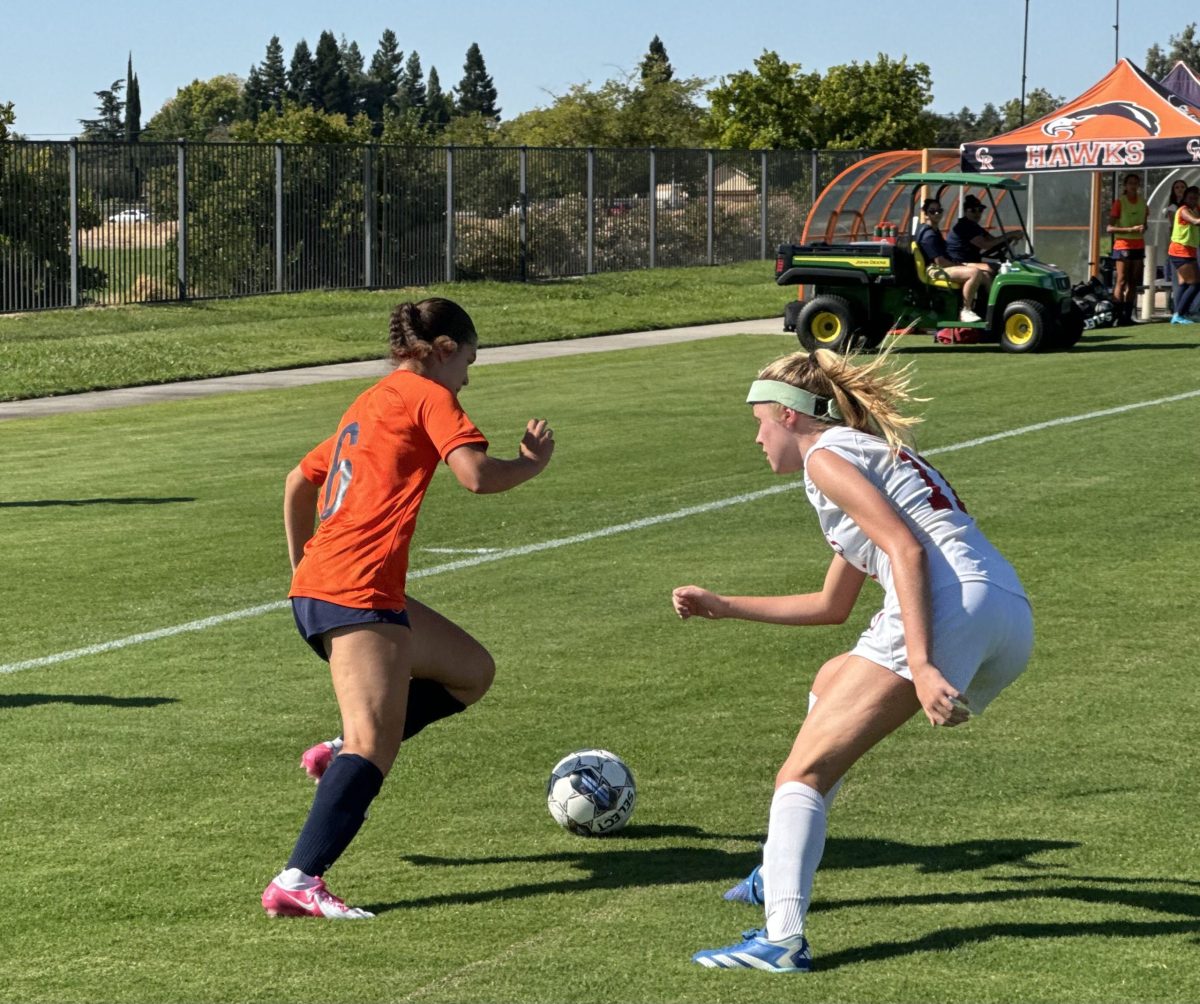 Sophomore forward Angelina Ortiz jukes a Las Positas College defender during their winning match at home on Aug. 27. The Hawks defeated the American River College Beavers 5-2 at home, making their record 8-4-2.