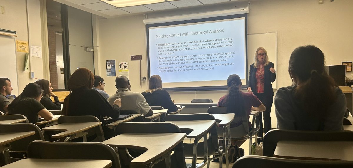 Communication studies Professor Georgine Hodgkinson discusses with her class the use of rhetorical devices by politicians on Oct. 15 in room BS 128. The political campaign communication course is available during election years and teaches students to analyze speeches and communication tactics of politicians. 