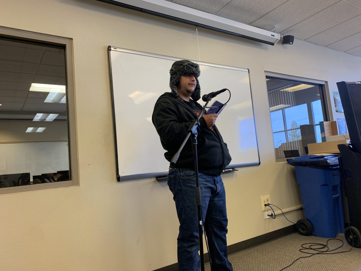 Isaac Dew-Hiersoux, a 23-year-old history major, shares his poem "Renaissance" on the open mic during Pies and Poetry in the Reading and Writing Center on Oct. 23, located in the Learning Resource Center in room 203. Pies and Poetry gives faculty the opportunity to present their poetry with limited open mic performances from students.