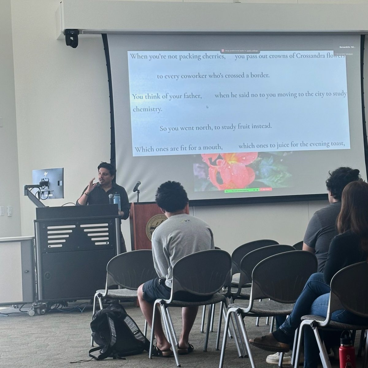 Author and poet Oswaldo Vargas reads part of his poem titled “Crossandra” during his presentation on Tuesday in Winn 150. Vargas talks about his experience as an undocumented queer writer as part of Undocumented Student Month of Action.