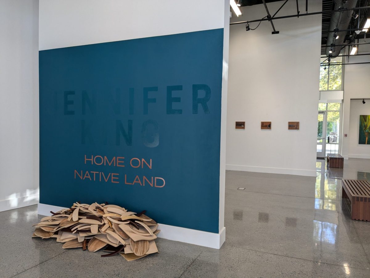 Jennifer King's "A Seat at the Table" piece lays in a pile under the exhibition title, containing deconstructed chairs. The exhibition will be open until Nov. 17 in Cosumnes River College’s Art Gallery.