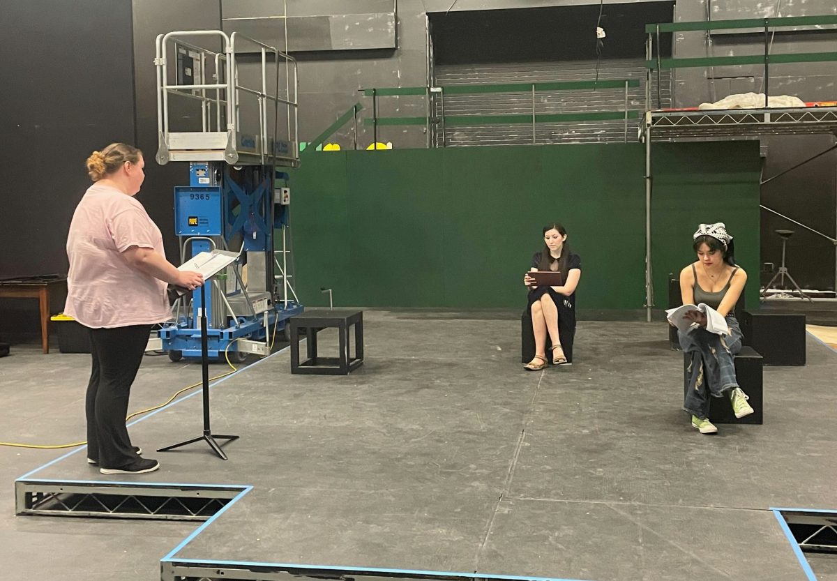 “Play It Straight” cast members Elfie Marcewicz, left, Summer Phemister, middle, and Salem Benner rehearse in the Black Box Theater on Oct. 15. The play discusses queer student rights through a spin on the story of “Romeo and Juliet.”