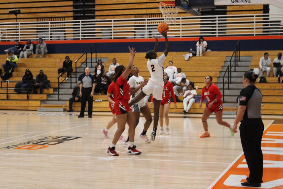 Sophomore guard and forward Aliviyah McMurray goes up for a layup against Foothill College defenders during Friday’s game at home. The Hawks won one out of two games they played during their Calamar Classic Tournament. 