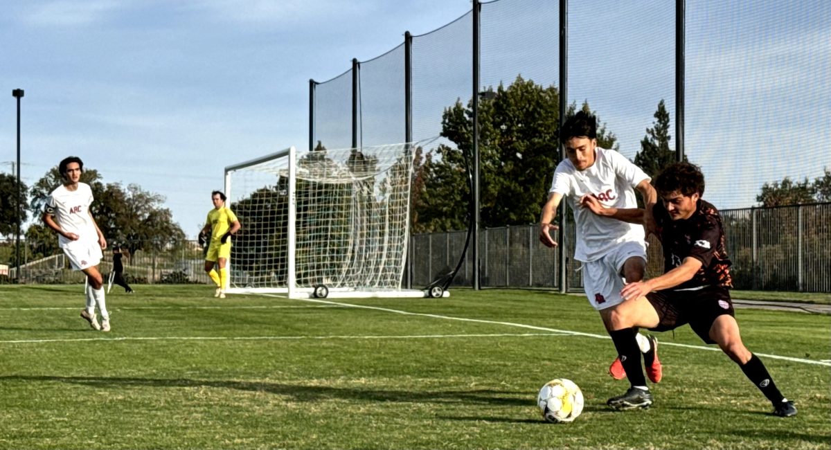 The Hawks’ freshman forward, Camden Locke, physically protects his possession of the ball against an American River College Beaver’s player at home on Nov. 5. The Hawks tie the Beavers 1-1 in the 90th minute after being down 0-1 early in the second half.