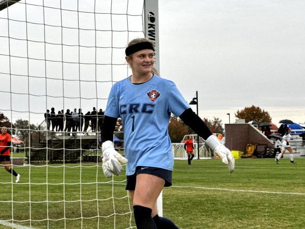 Sophomore goalkeeper Mellanie Chernay walks behind the Hawks' goal post to grab a spare ball and a sip of water during the first round of the 3C2A Women's Northern California Regional Soccer Championships at home on Nov. 20. The Hawks go on to defeat their opponent, the Butte College Roadrunners, 6-0 during a wet and rainy game.