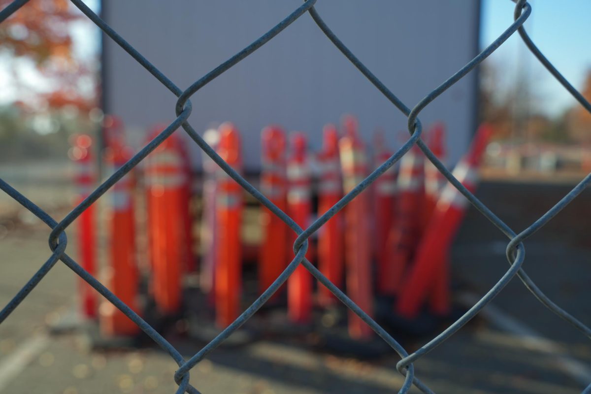 Construction cones sit behind a chain link fence in Parking Lot C of the Cosumnes River College campus. California K-12 schools, community colleges and career education programs will have $10 billion to upgrade their facilities after passing Proposition 2 in the 2024 General Election. 