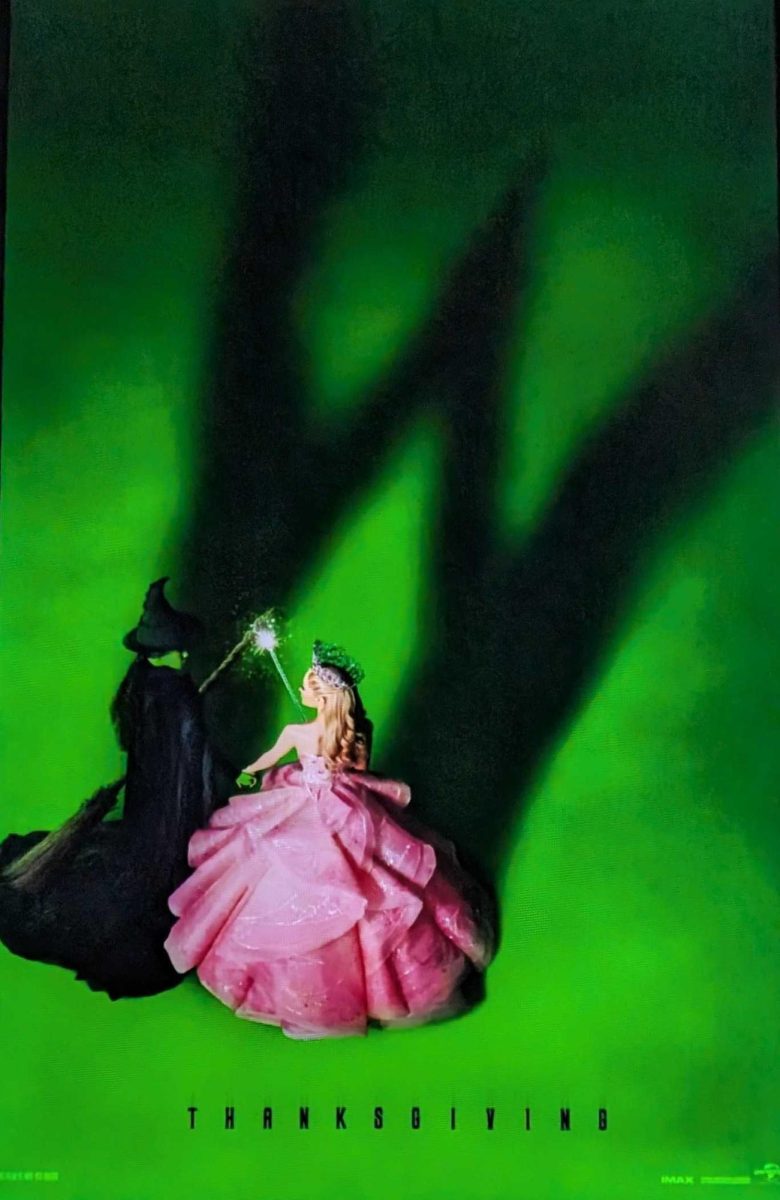 The poster for “Wicked” displays at the theater, promoting the film which debuted globally on Nov. 22. Directed by Jon M. Chu, known for “Crazy Rich Asians,” “Wicked” has a visual appeal that did not fall in line with the overall structure of the story.