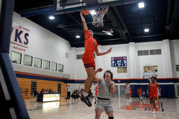 Freshman guard Mason Marsh delivers a dunk against Feather River College during Tuesday’s home game. The Hawks go on to defeat the Golden Eagles 93-54 and improve their record to 4-2 overall.