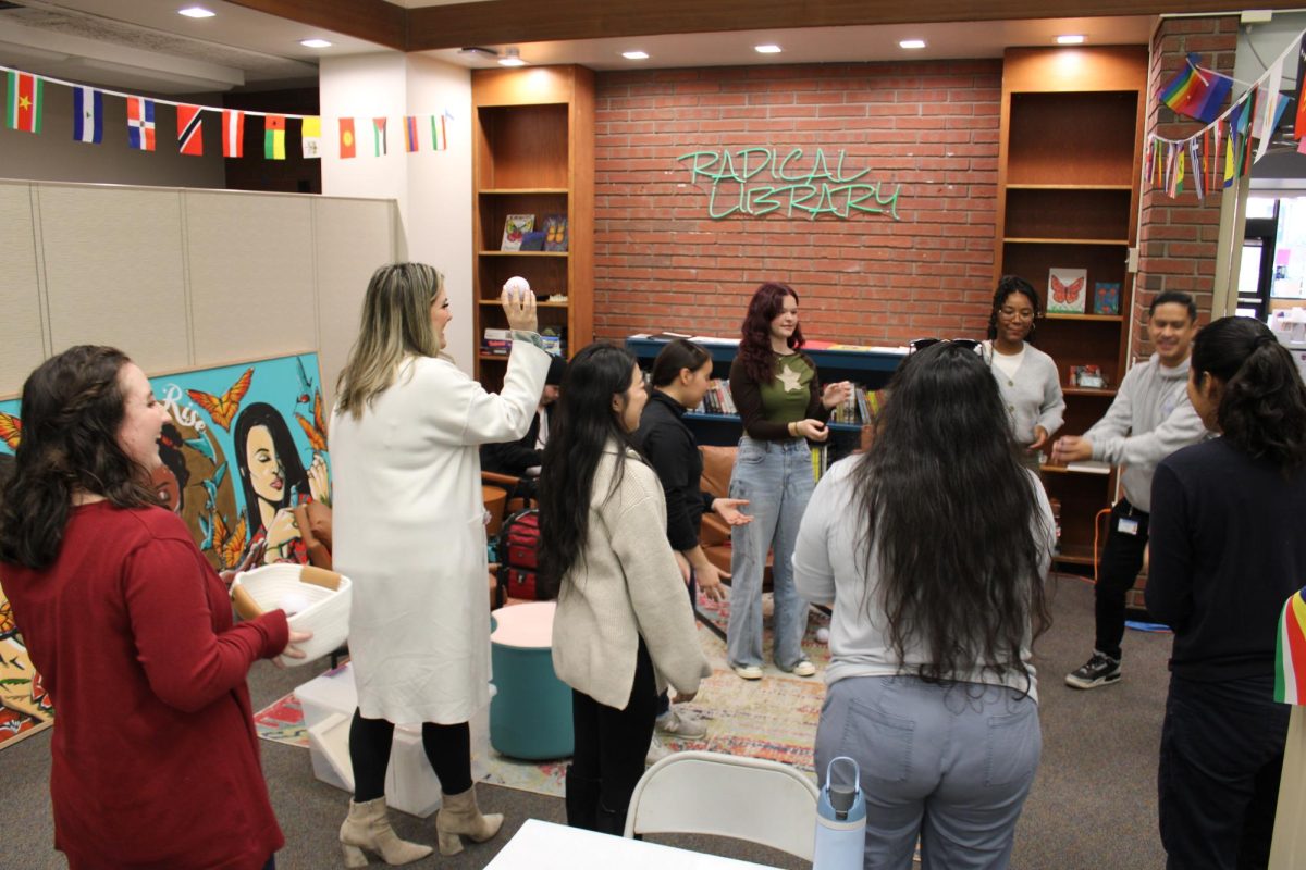 Mental health intern Reyna Bazikian starts off the first activity during the Unwind & Thrive event on Tuesday in the Center of Inclusion and Belonging. Coffee and Tea from Pittador Brews will be the last mental health activity campus hosts from Dec. 10 to 12 in the first floor lobby of the library.