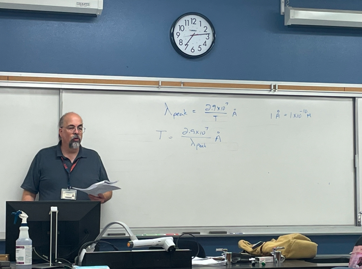 Astronomy Professor Michael Strong teaches his astronomy laboratory class in Science 306 on Jan. 23. After overcoming hearing loss, Strong weaves humor about the challenges he’s faced into his teaching.