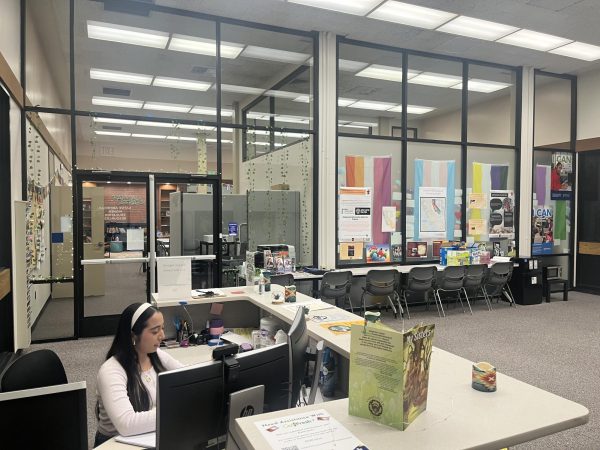 Student Emissary Anaiah Rodriguez sits at the front desk of the NAHER facility in library room 106-C. The facility is open for all Native students for support and community building Monday through Friday from 9 a.m. to 4:30 p.m. 