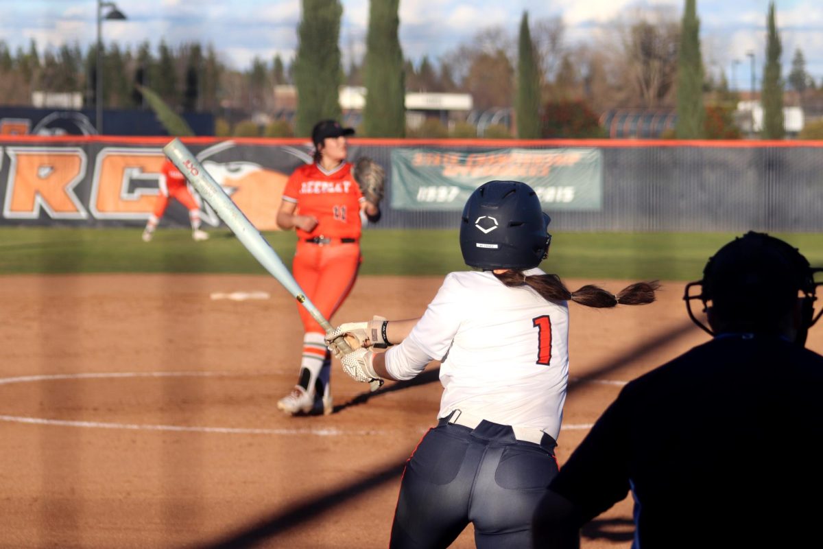 Sophomore right fielder Clare Yanez swings at a pitch against Reedley College. The Hawks improved to a 4-2 record after their doubleheader victory on Friday.