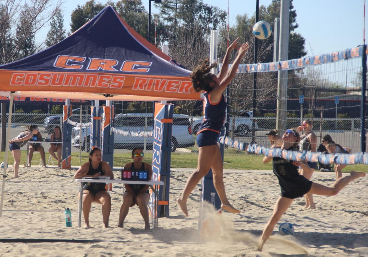 Sophomore split Kaylie Reyes jumps for a block in the win against College of Marin. The Hawks begin conference play on Friday with a rematch against the Mariners.