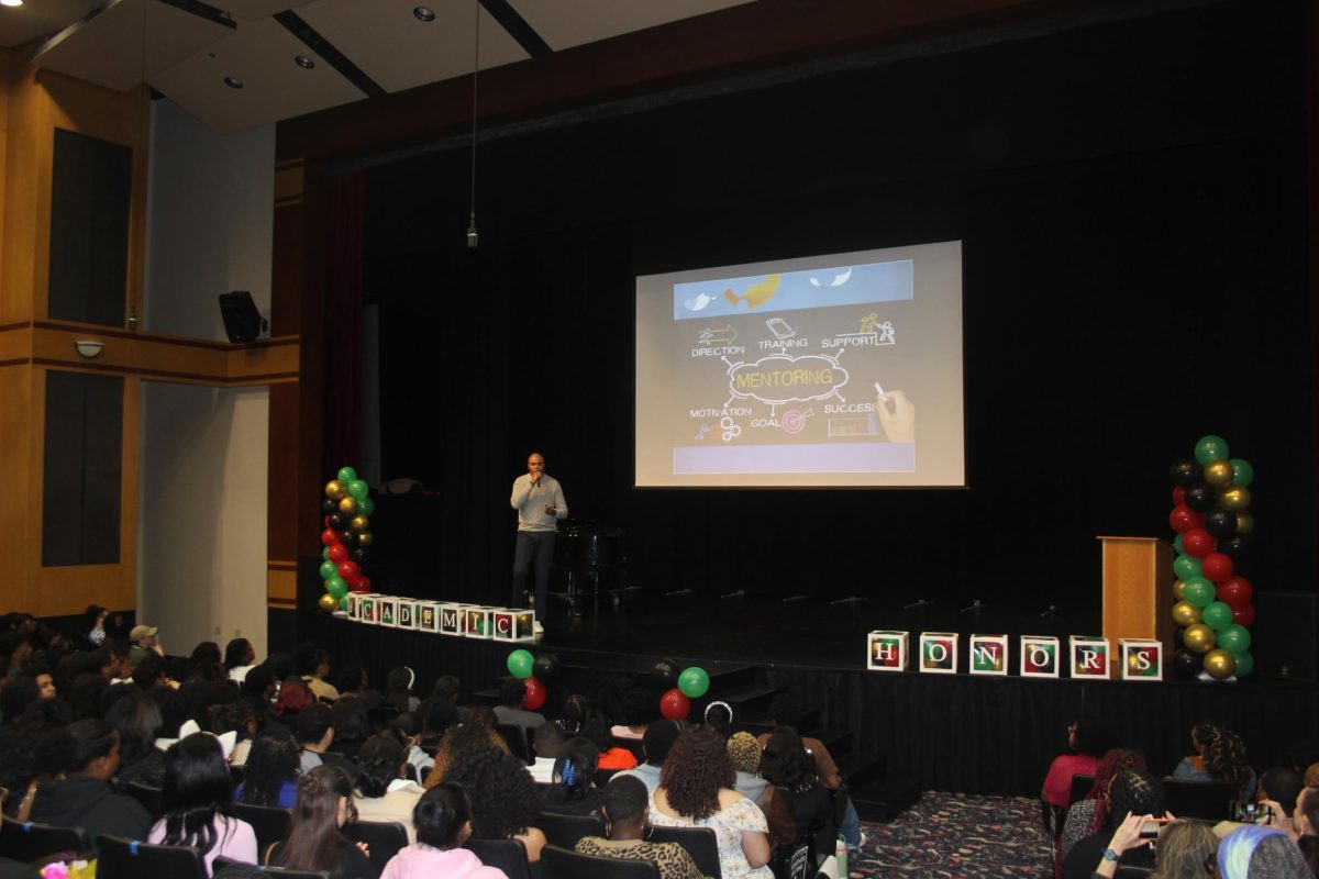 Chief of Compliance of the United States Department of Education Dr. Michael Marion Jr. speaks about mentoring within the Black community at the Recital Hall. The honors ceremony closed out Black History Month.